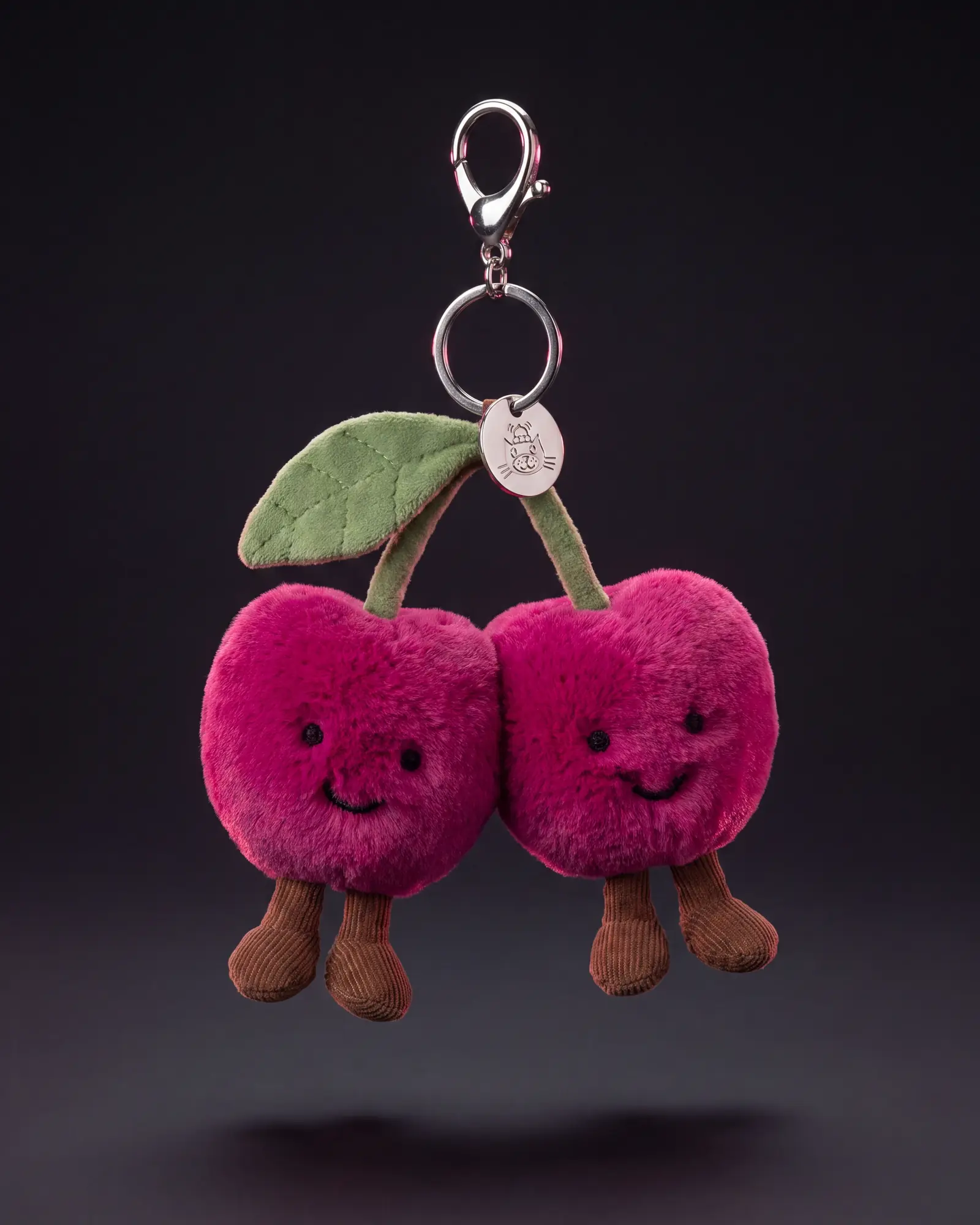 Amuseables Cherries Bag Charm, 어두운 스튜디오 배경.